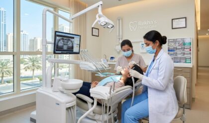 Female dental assistant working with dentist at Rekha’s Dental Care clinic in Sharjah using modern dental equipment