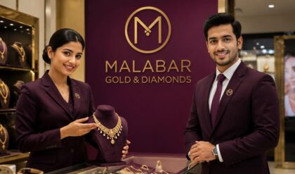 Professional showroom interior of Malabar Gold & Diamonds in the UAE featuring luxury gold and diamond jewellery displays, elegant lighting, customer service executives assisting shoppers, and a premium retail atmosphere representing trust, quality, and international excellence.