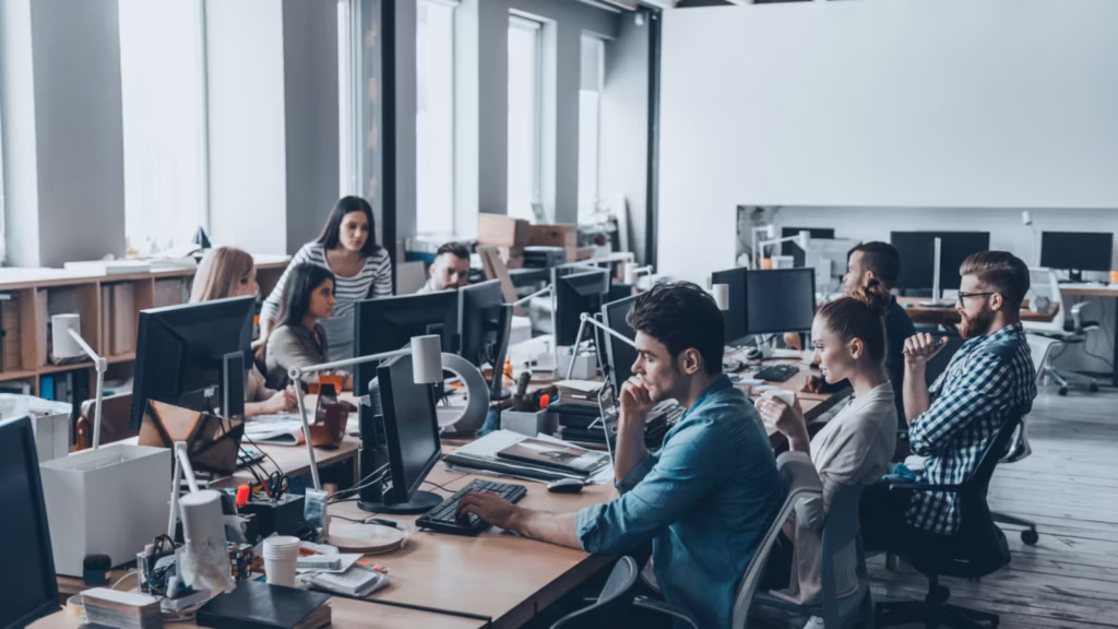 Qatar Insurance Company Announces Multiple Career Opportunities in different Roles 1 Employees at work