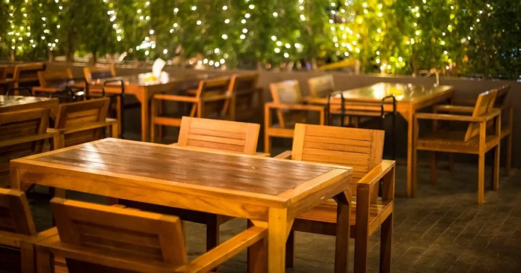 restaurant tables and string lighting e1791629415133