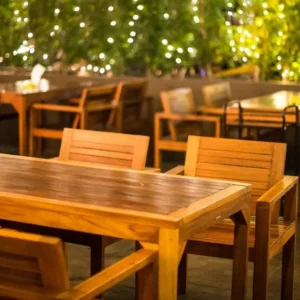 restaurant tables and string lighting e1791629415133