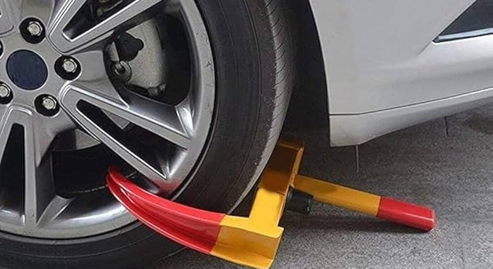 Kuwait Simplifies Vehicle Clamp Removal Process കുവൈത്തിൽ വാഹനത്തിൽ ക്ലാമ്പ് വീണാൽ ഇനി നടപടികൾ എളുപ്പം 1 wheel clamp e1790827322725